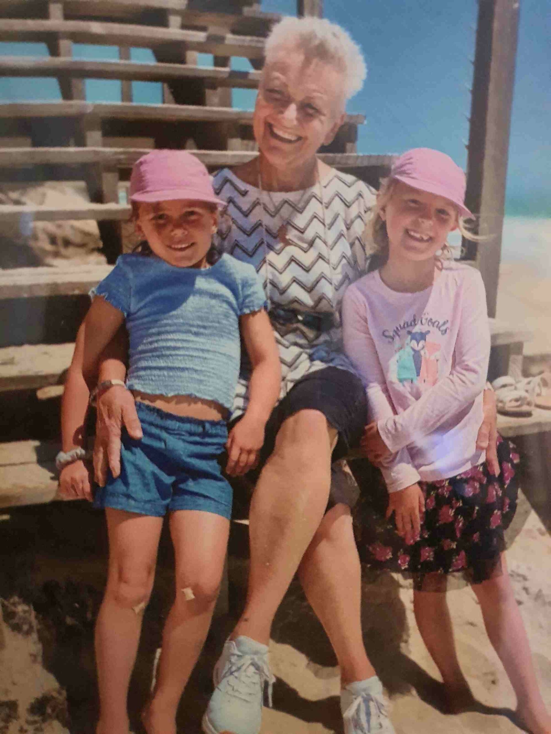 image of Lindy surrounded by her grand children. Lindy is surviviing ovarian cancer